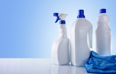 Cleaning products on white table overview