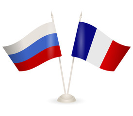 Table stand with flags of Russia and France. 