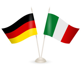 Table stand with flags of Germany and Italy. 
