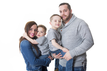 attractive portrait of young happy family over white background