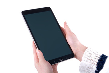 Tablet in the women hands on a white background