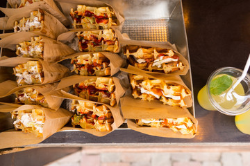 Brown paper packets of takeaway sandwiches