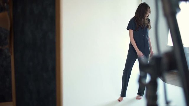 backstage photoshoot model posing in pyjama slow motion 