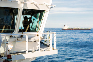 Fototapeta premium Watchman on the navigation bridge