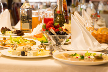 Plates of eats and appetizers on a buffet table