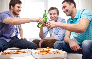 close up of friends with beer and pizza at home