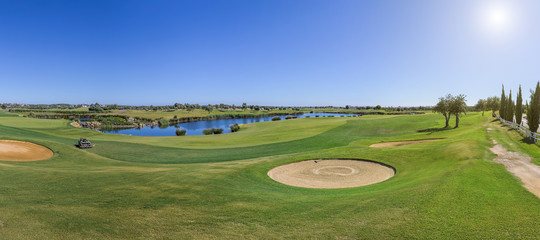 Panorama of a golf course on sunny day. 