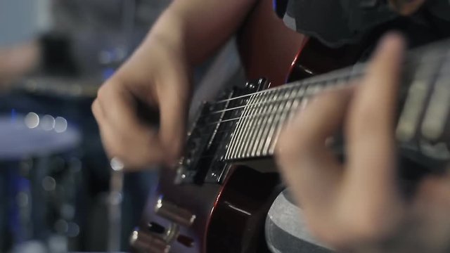 guitarist playing. close-up. arm