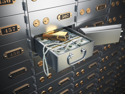 Open safe deposit box with money, jewels and golden ingot.