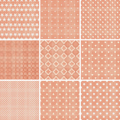 set of abstract geometric seamless patterns in faded orange color with fabric texture