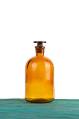 medicine bottle on wooden table isolated