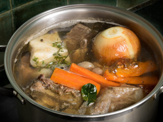 Stock in a steel pot on the stove