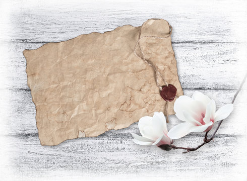 Magnolia and old paper with wax seal