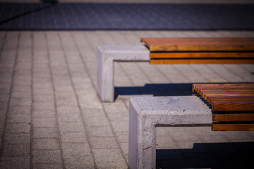 Color picture of wooden covered concrete bench closeup