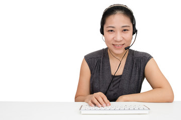 Asian Woman with Headset Using Keyboard