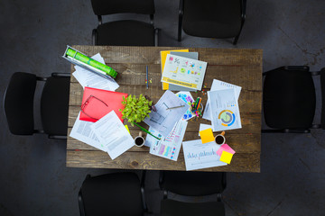 Top view of business objects on wooden table