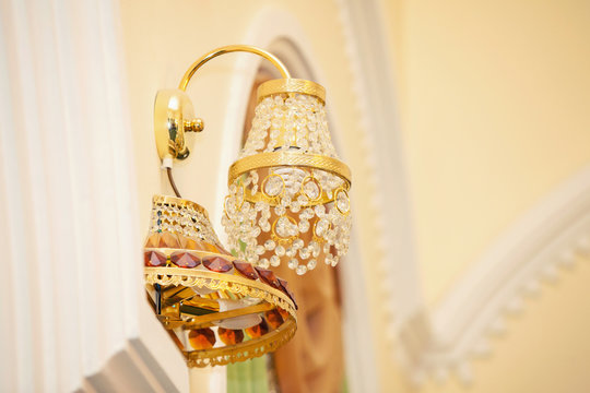 the gold-plated wall lamp with stones