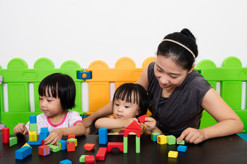 Asian Kids and Mother Playing Together