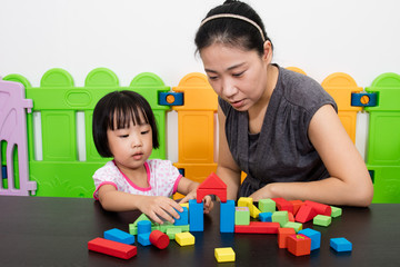 Asian Little Chinese Girl and Mother Playing Together