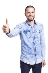 Naklejka premium Young casual man thumbs up over white background