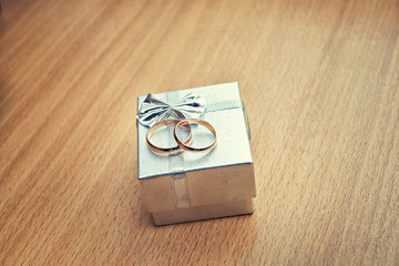 wedding rings on silver packing