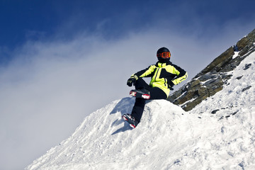 Fototapeta na wymiar young man enjoying winter skiing