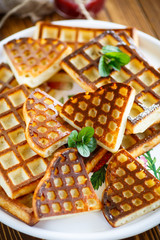 baked cheese waffles with powdered sugar