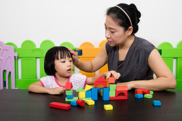 Asian Little Chinese Girl and Mother Playing Together
