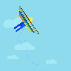  Flat colorful kite flying on the background of blue sky and clouds. Cartoon kite flying flies in the sky. Vector stock illustration.