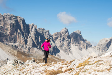 Fototapeta premium Young girl trains in the mountains