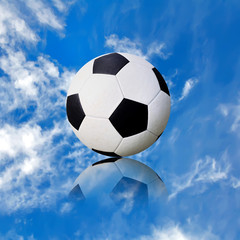 ball soccer ball against the blue sky