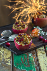 Festive baked red apples stuffed with granola, cranberries and marzipan