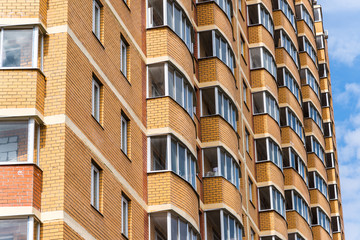 Modern high-rise apartment building made of brick
