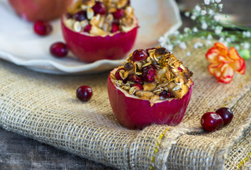Festive baked red apples stuffed with granola, cranberries and marzipan