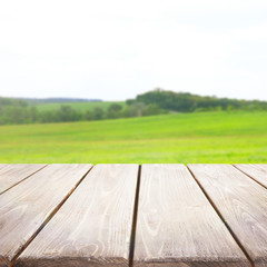 Wooden table on blurred nature background
