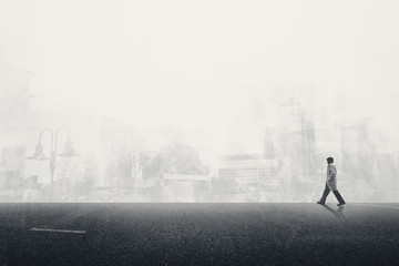 man walking on the grey street in city - obrazy, fototapety, plakaty