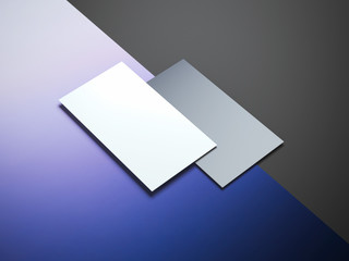 Two business cards on a color surface