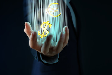 Businessman showing dollar and euro sign in his hand, on dark background