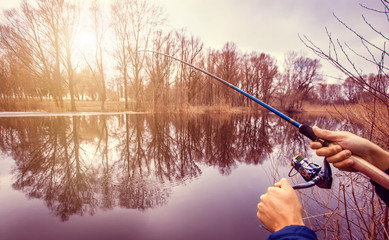 Fisherman holding the spinning rod
