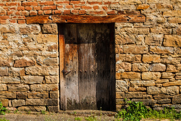 Fototapeta na wymiar Rural house with wooden door