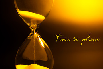 Hourglass on dark yellow background