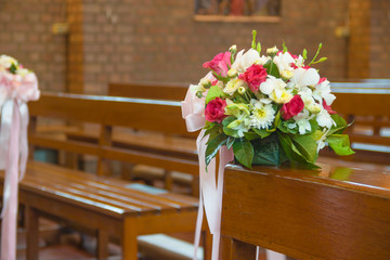 Fototapeta na wymiar Beautiful flower wedding decoration in a church
