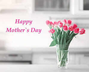 Fresh bouquet of tulips in kitchen