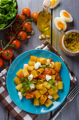 Rigatoni pasta with mozzarella and tomato