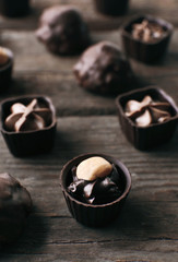 Chocolate sweets on wooden background