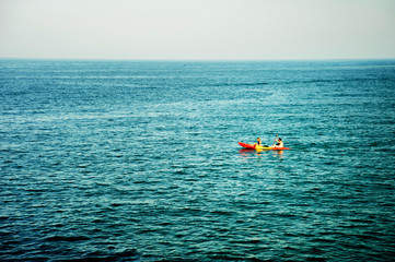 Tourists kayaking in the sea 