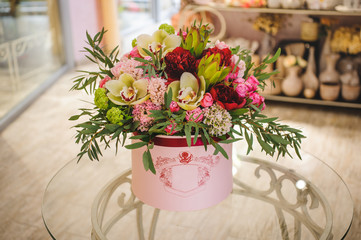 big bright pink bouquet in round box with lid