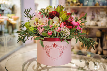 big bright pink bouquet in round box with lid