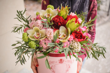 big bright pink bouquet in round box with lid