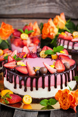 Delicious double cheesecake decorated with chocolate and fresh s